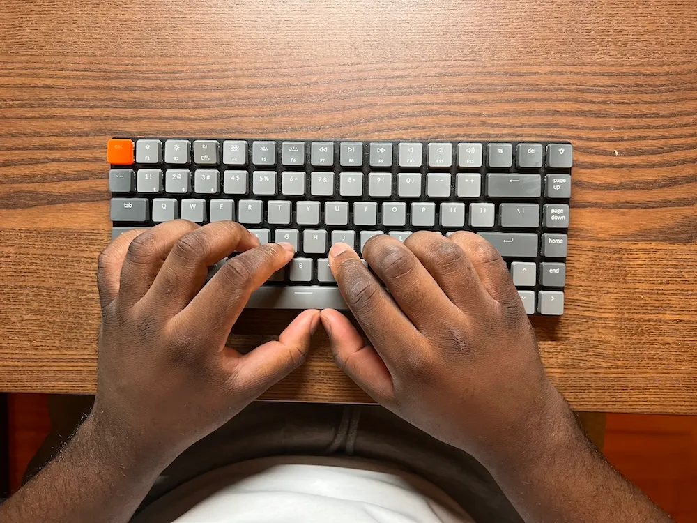 Hand position on a classic keyboard, where the wrists are forced into an unnatural orientation.